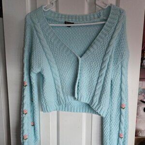 Light blue cropped sweater with pink flowers